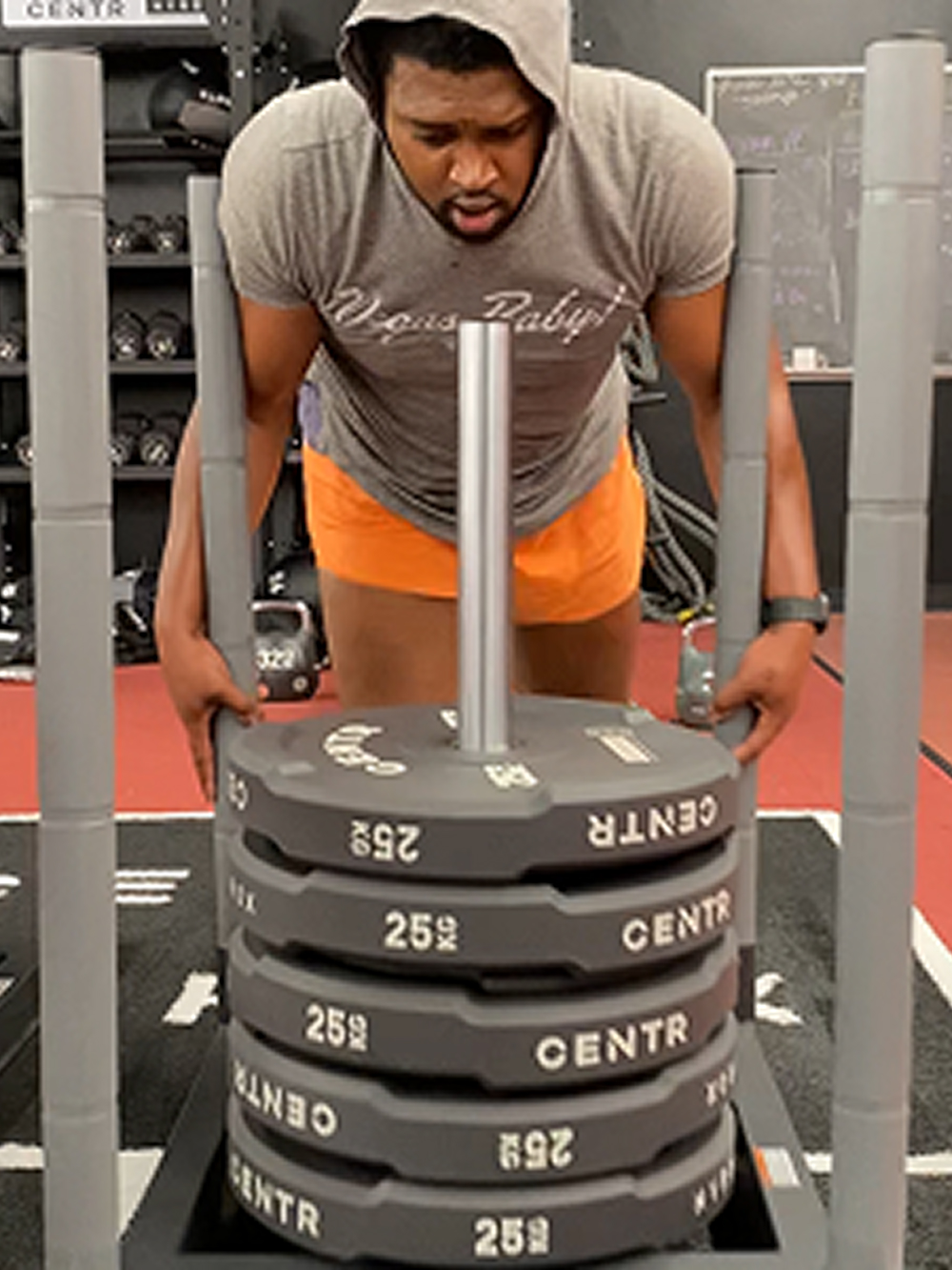 Coach Jason Dupree training an athlete